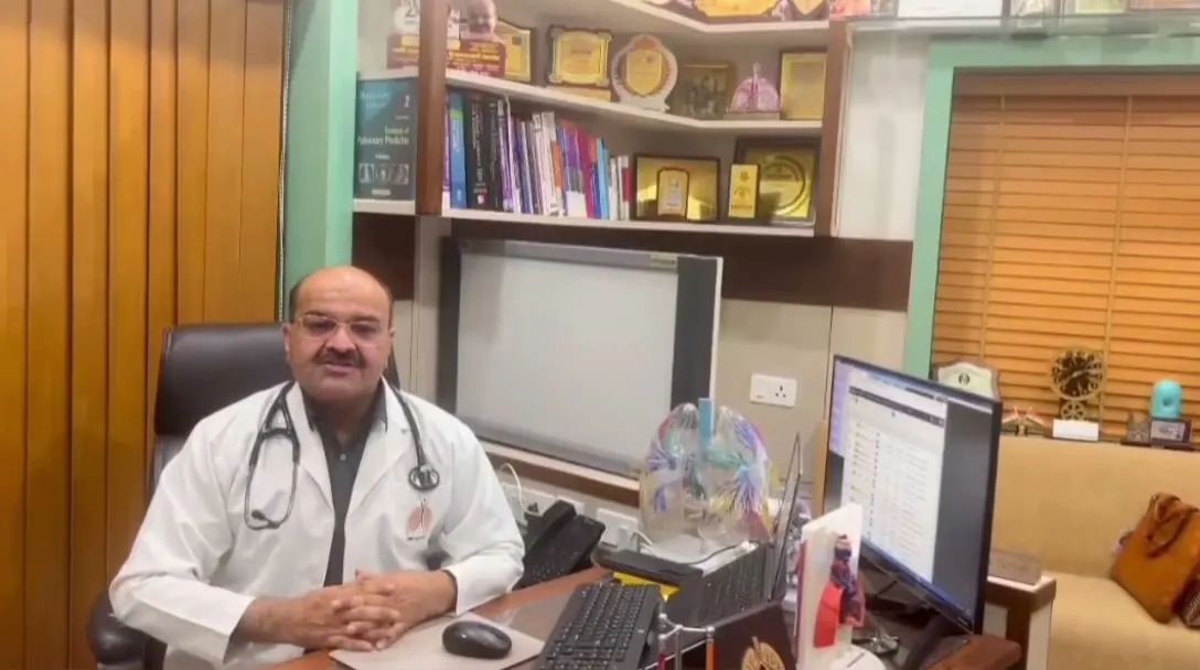 Dr. Veerottam Tomer speaking in his consulting room