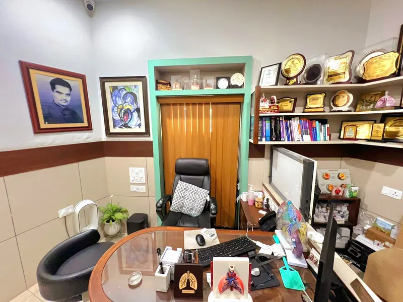 The consulting room, with his father Dr. Shivraj’s portrait on the wall